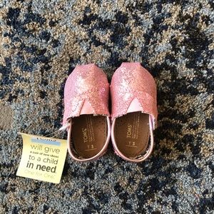 Pink glitter baby Toms shoes